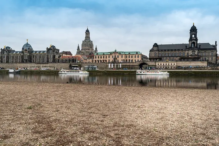 Historic Dresden buildings along the opposite riverbank.