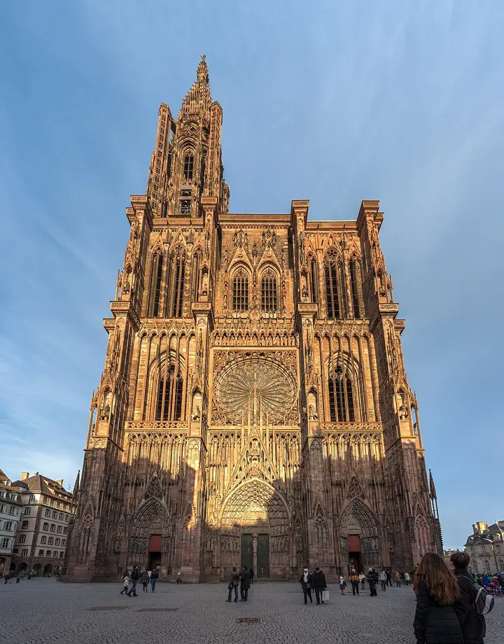 Ornate cathedral facade rising above a street in Strasbourg.